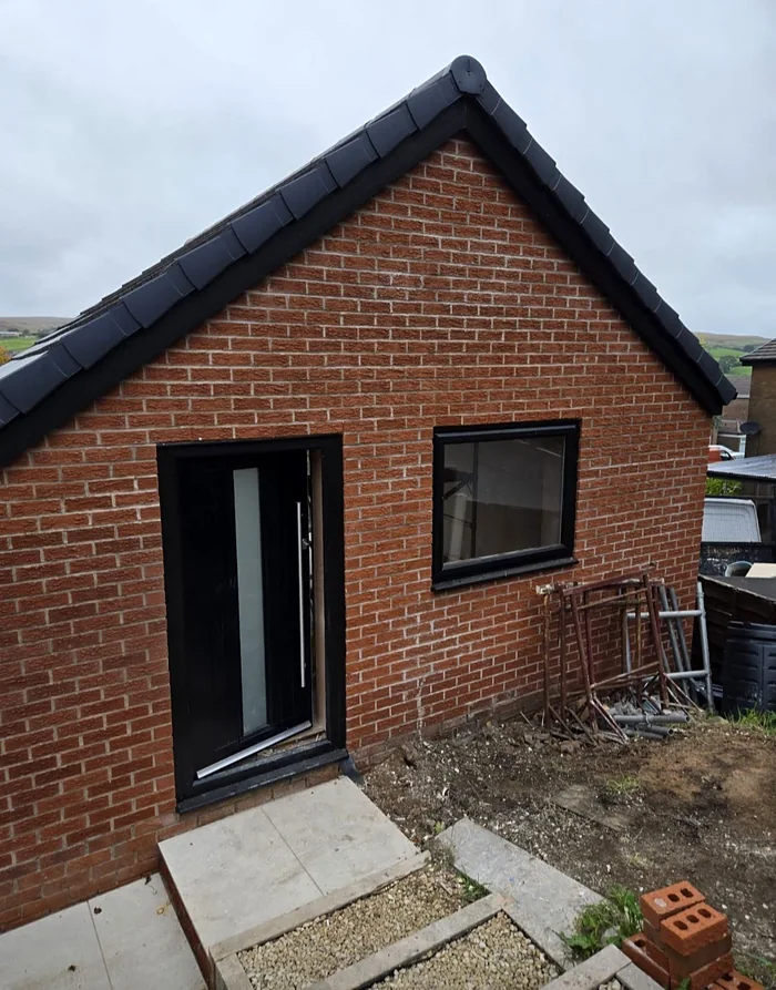 Side door and window in the new brickwork