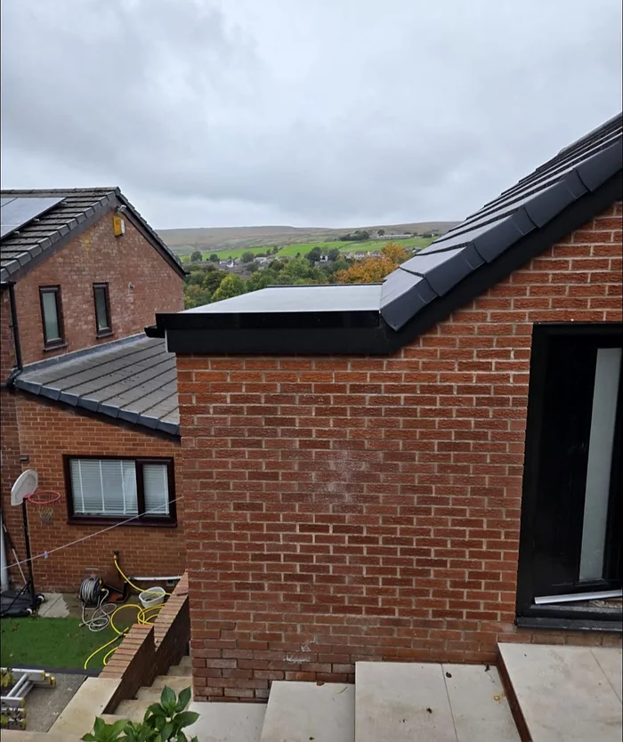 The extension seen from the steps above, roof tiled