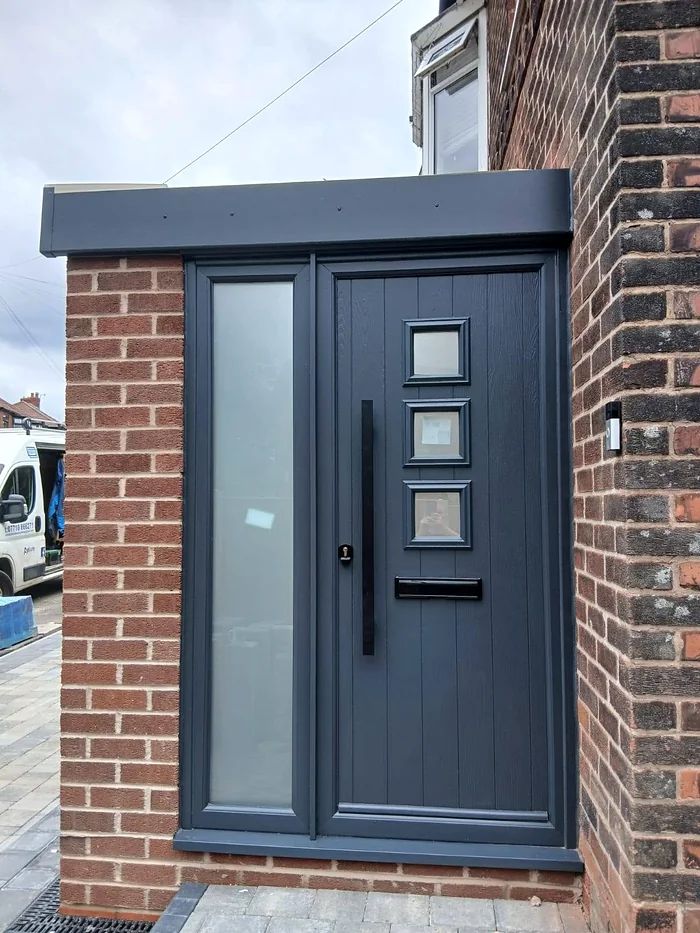 Anthracite composite door with side glazing in the new porch